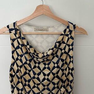 Women’s vintage Balenciaga dress. The color is yellow/gold with navy patterns.